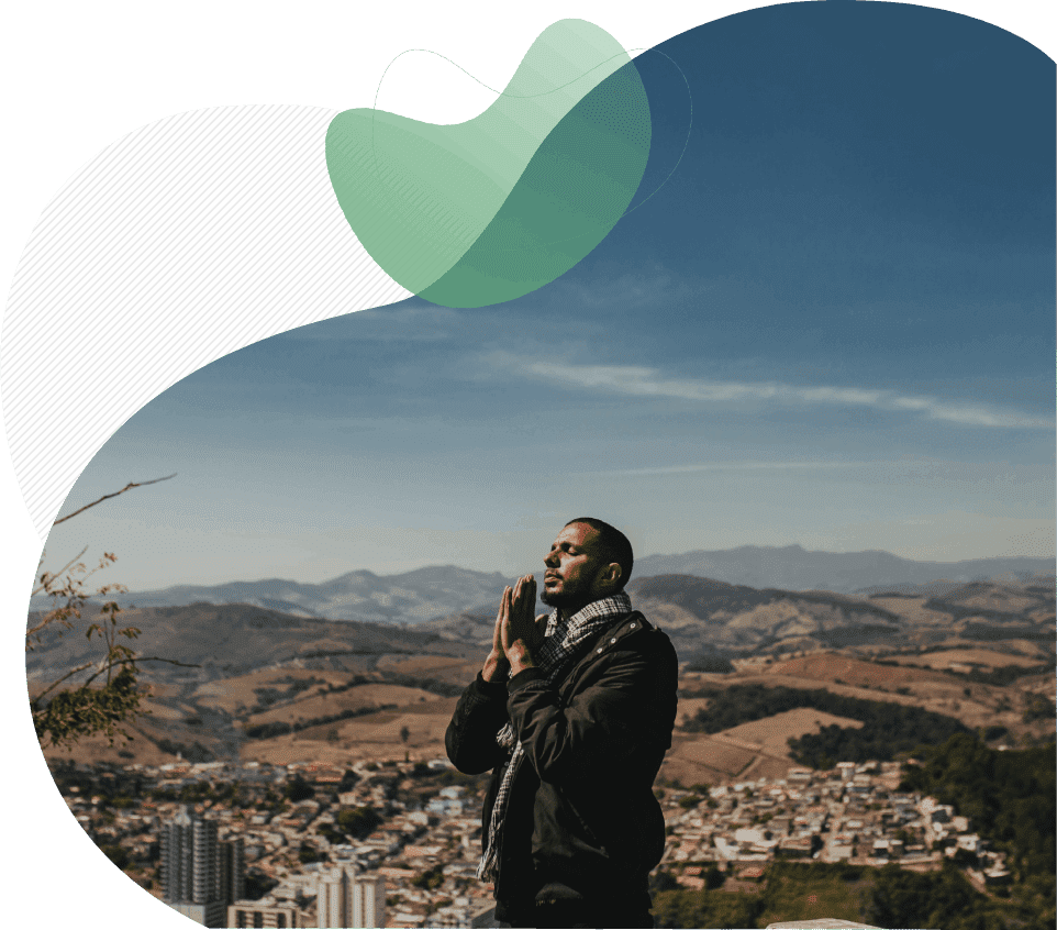 Man praying to god at morning on mountains